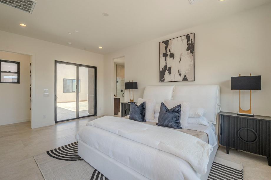 Expansive primary bedroom with luxurious finishes